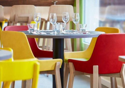 a table in a restaurant with wine glasses on it at Ibis Styles Istanbul Atasehir in Istanbul