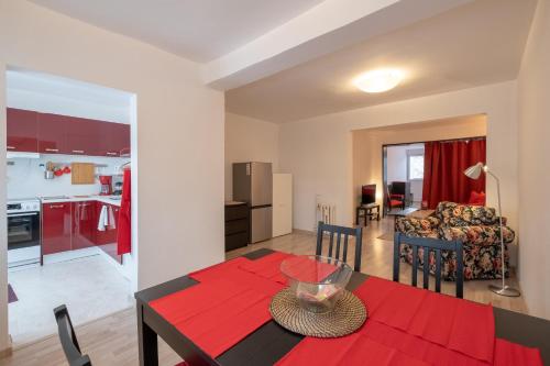 a kitchen and a living room with a table and a dining room at LZ Spacious One Bedroom Apartment in Top Centre in Sofia