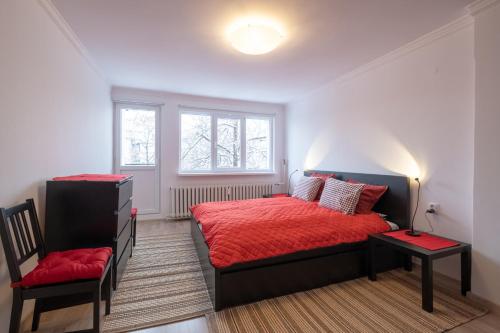 a bedroom with a bed and a chair in it at LZ Spacious One Bedroom Apartment in Top Centre in Sofia