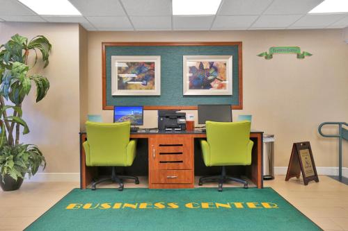 an office with two chairs and a desk with a computer at Hollywood Beach Tower in Hollywood