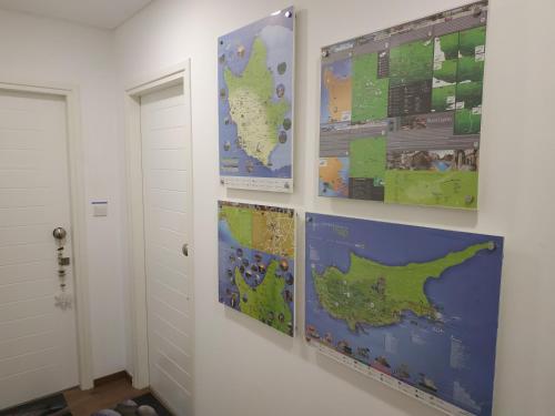 a room with two maps on the wall at City Center Apartments in Paphos City