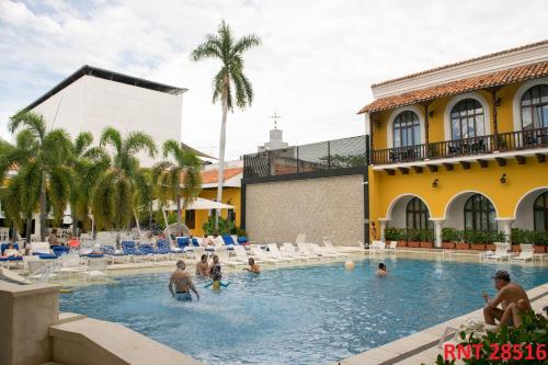 a group of people in the swimming pool at a hotel at Hotel Union in Girardot