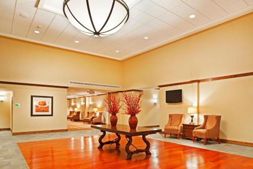 a waiting room at a hospital with a table and chairs at The Ramsey Hotel and Convention Center in Pigeon Forge