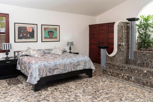 Una cama o camas en una habitación de Cabarete Palm Beach Condos