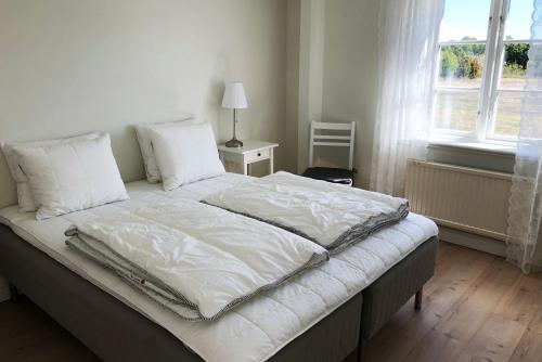 Postel nebo postele na pokoji v ubytování Warfsholm