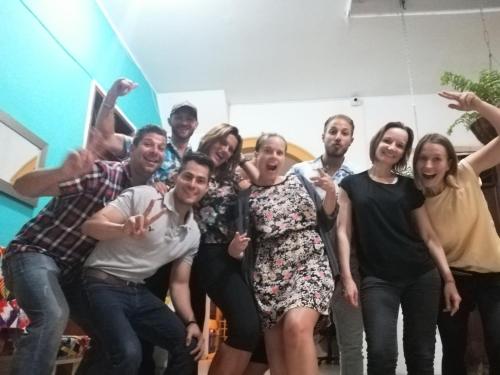 a group of people posing for a picture at La Casa de Adry in Cali