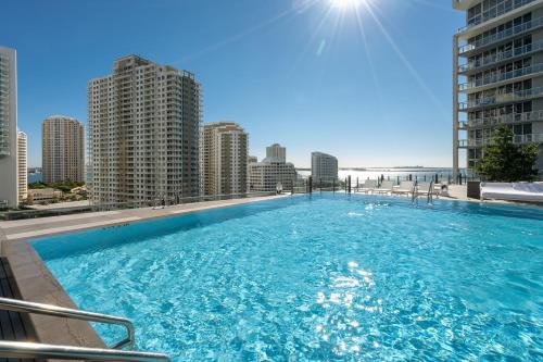 a large swimming pool on the roof of a building at ICON Brickell residences in Miami