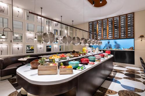 a buffet line in a restaurant with food at Mercure Shanghai Hongqiao Central in Shanghai
