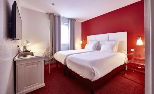 Postel nebo postele na pokoji v ubytování Best Western Plus Au cheval Blanc à Mulhouse