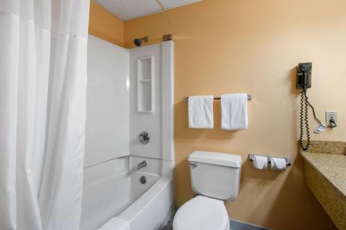 a bathroom with a white toilet and a shower at Quality Inn Carlisle PA in Carlisle