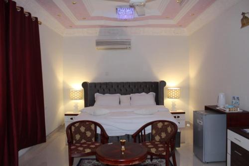 Un pat sau paturi într-o cameră la Tafadal