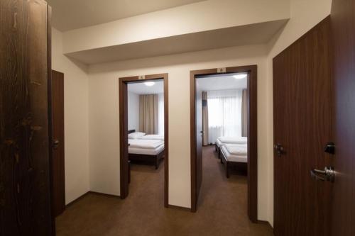 Postel nebo postele na pokoji v ubytování Hotel Polianka