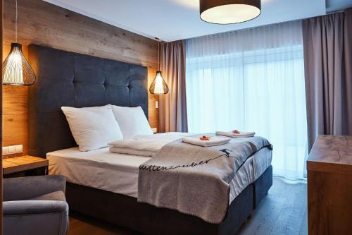 Una cama o camas en una habitación de Ötztal Residenz