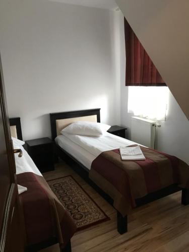 מיטה או מיטות בחדר ב-Farkas Panzió