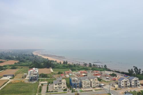 an aerial view of a city with houses at 嚨口秘境觀海民宿The heart of the sea in Jinning