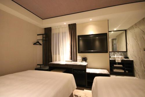 Cama o camas de una habitación en Hotel Midtown Richardson - Kaohsiung Bo'ai