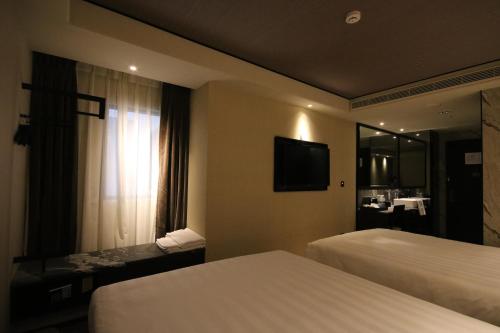 Cama o camas de una habitación en Hotel Midtown Richardson - Kaohsiung Bo'ai