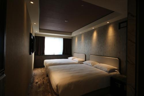 Cama o camas de una habitación en Hotel Midtown Richardson - Kaohsiung Bo'ai