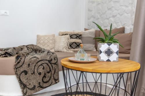 a living room with a table and a couch at Emery Hotel in Naxos Chora