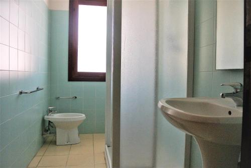 
Koupelna v ubytování Condominio LISA
