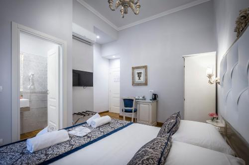 Ένα ή περισσότερα κρεβάτια σε δωμάτιο στο B&B La Terrazza Sul Duomo