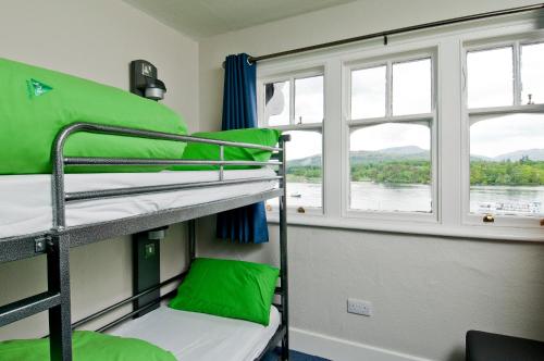 a room with two bunk beds and a window at YHA Ambleside in Ambleside