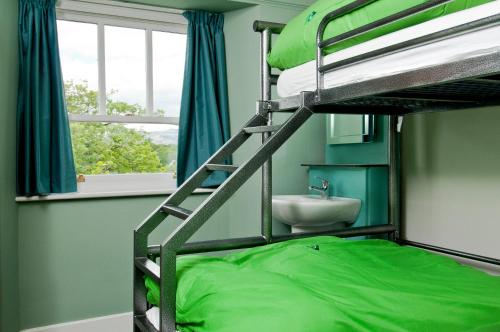 a bedroom with a bunk bed and a sink at YHA Ambleside in Ambleside