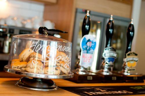 a glass container filled with food on top of a bar at YHA Ambleside in Ambleside