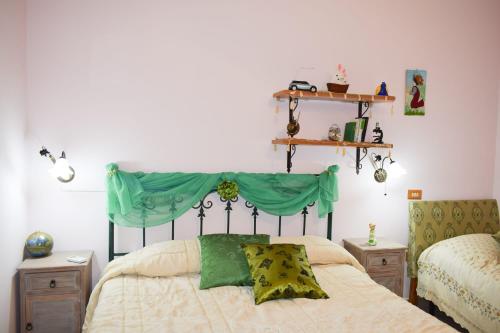 Posteľ alebo postele v izbe v ubytovaní B&B Lo Smeraldo