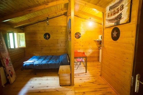 Cama o camas de una habitación en Cabañas Rurales El Hayal