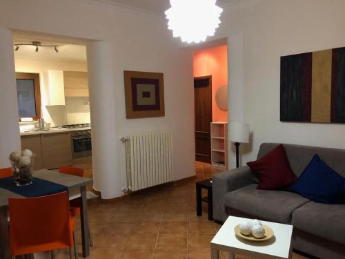 a living room with a couch and a table at A Casa Di Tina in Cassino