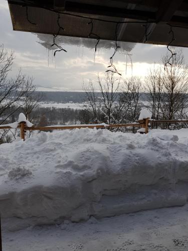 a pile of snow in front of a fence at Osada Knurów in Knurów