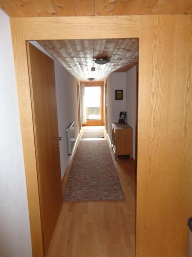 a hallway leading to a room with a door at Haus Annelies in Au im Bregenzerwald