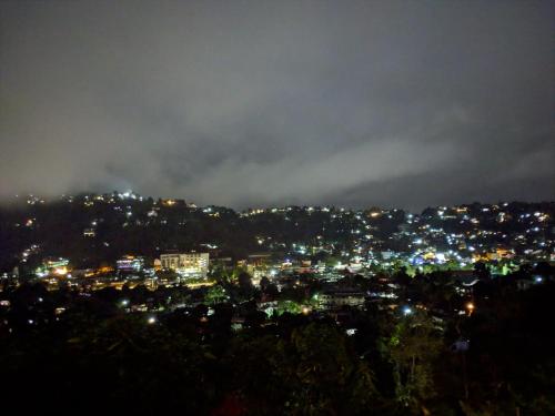 a view of a city at night with lights at Jaya Tomodachi in Kandy