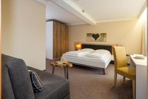 Postel nebo postele na pokoji v ubytování Hotel Burgfrieden