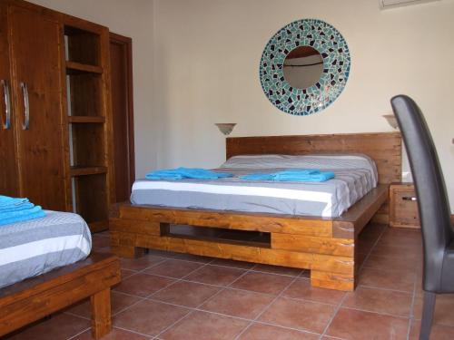 Posteľ alebo postele v izbe v ubytovaní agriturismo corallo