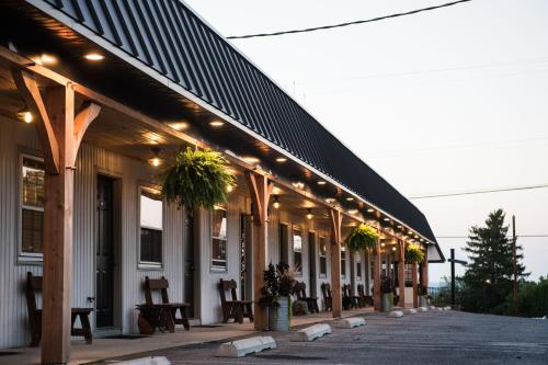a building with a black roof with lights on it at The Carriage House at Strasburg in Strasburg