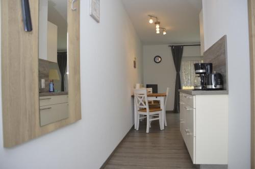 a hallway with a kitchen and a dining room at Spreewaldpension Hahn in Alt Zauche