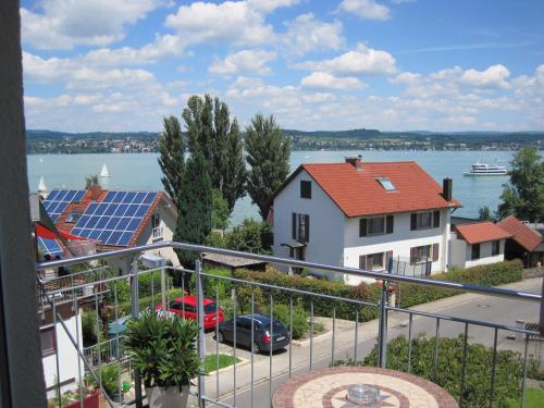 a view from the balcony of a house with solar panels at Seeblick Imperia in Konstanz