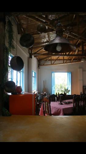 a room with several lights hanging from the ceiling at Buriti EcoH RNT56521, via Termales Santa Rosa de Cabal in Santa Rosa de Cabal