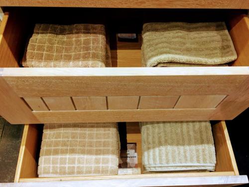 a wooden box with two beds in it at Villa Tomasso in Eeklo