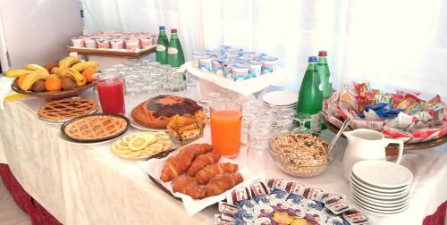 a table with a buffet of food and drinks at San Gabriele in Loreto