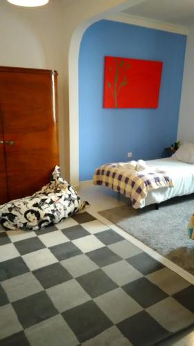 Postel nebo postele na pokoji v ubytování Vasco Santana Guesthouse