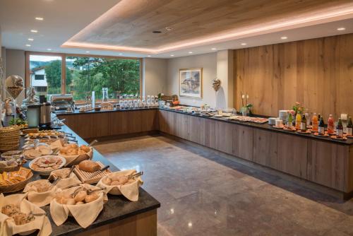 a buffet line with bread and pastries on display at Hotel Madonna in Castelrotto