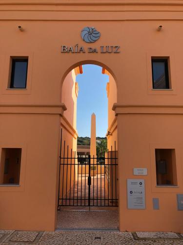 an entrance to the gate to the baja da livia building at Rother Praia da Luz Luxury Apartment in Luz