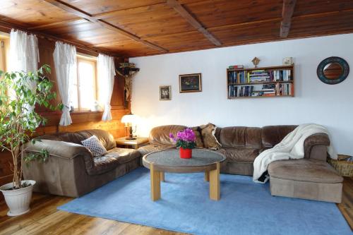 a living room with couches and a coffee table at Rosenhof in Görisried