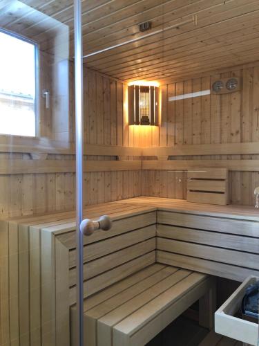 a sauna with wooden paneling and a window at HS - Rockhaus in Pruggern