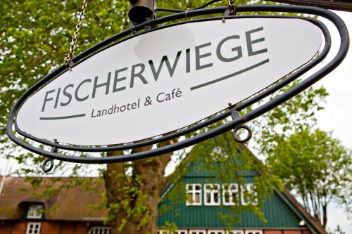 a sign for the entrance to a restaurant at Fischerwiege am Passader See in Passade
