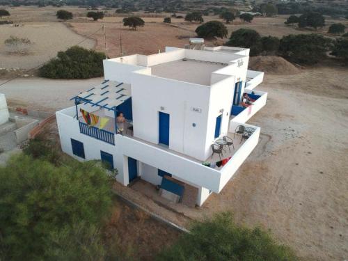 an aerial view of a white house in a field at Vigles in Adamantas