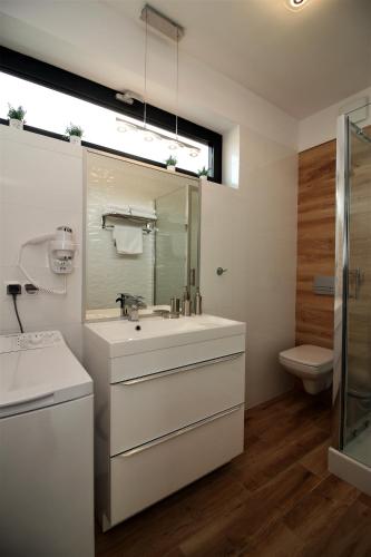 Ванная комната в Apartamenty Przy Latarni Kropla Bałtyku